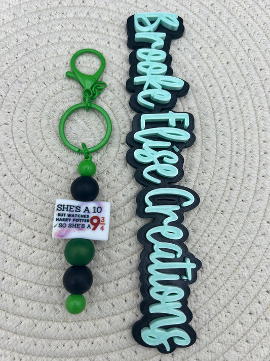 Green She’s a 9-3/4 keychain